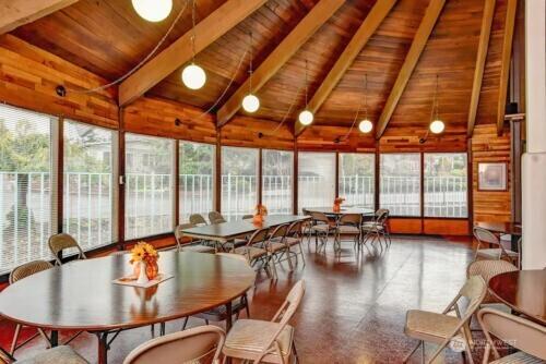 sunroom / solarium with wooden ceiling and vaulted ceiling with beams