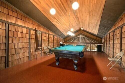 recreation room with lofted ceiling, carpet, wood ceiling, and pool table