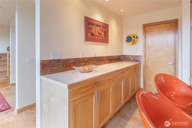 bathroom featuring tile patterned flooring and a soaking tub