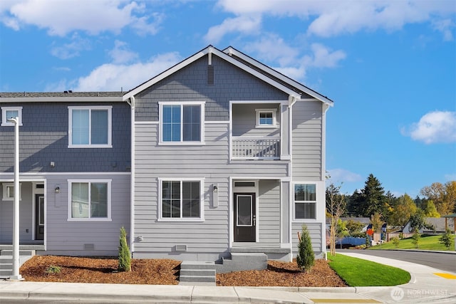 townhome / multi-family property featuring crawl space and a balcony