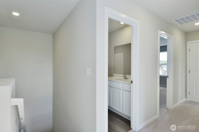 bathroom with recessed lighting, visible vents, baseboards, and vanity