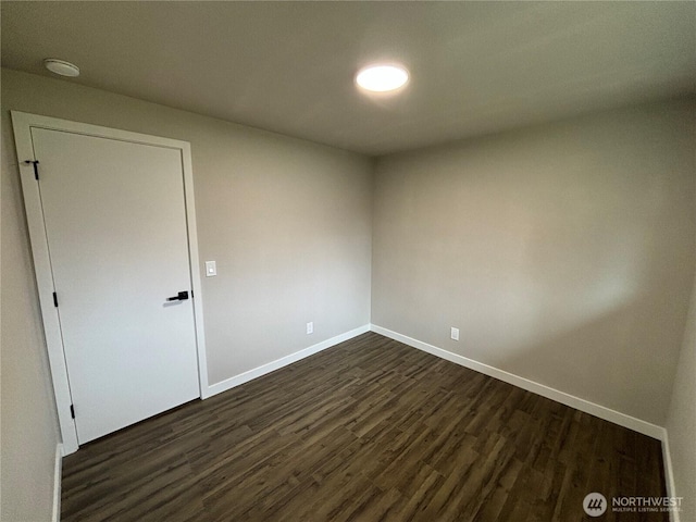 11713 100 Avenue Ct E, Puyallup, WA 98373 - spare room with baseboards and dark wood finished floors