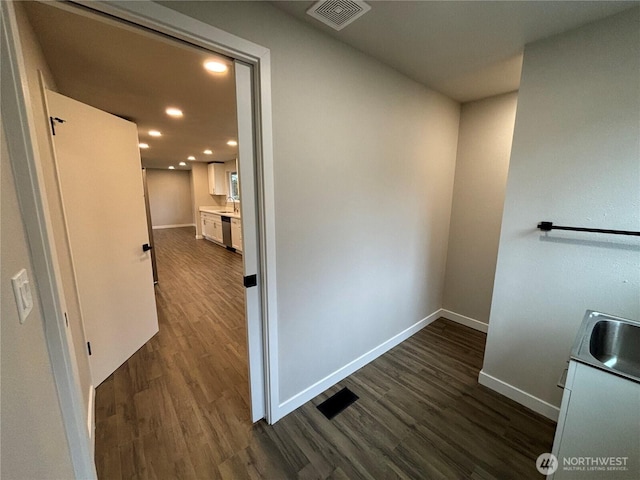11713 100 Avenue Ct E, Puyallup, WA 98373 - hallway featuring baseboards, visible vents, dark wood finished floors, recessed lighting, and a sink
