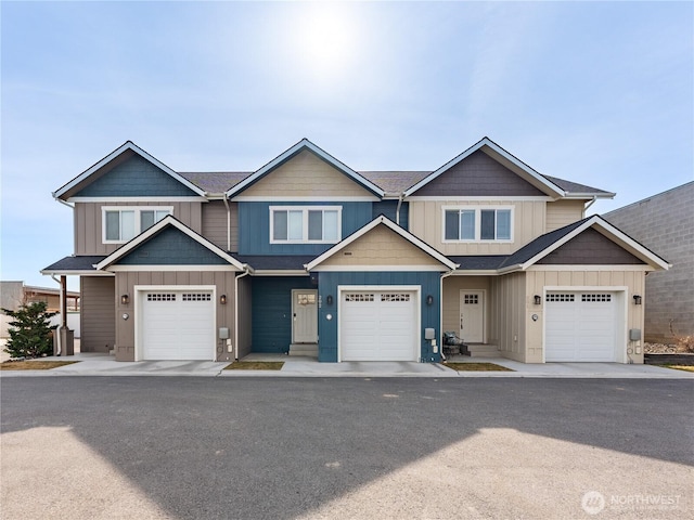 multi unit property with a garage and board and batten siding