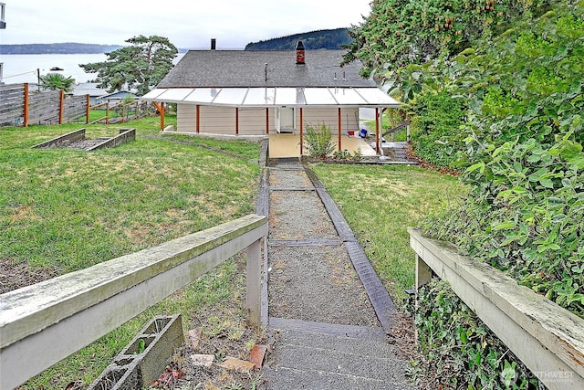 view of yard featuring a vegetable garden and fence