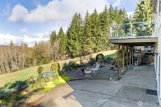 view of yard with a patio area and a deck