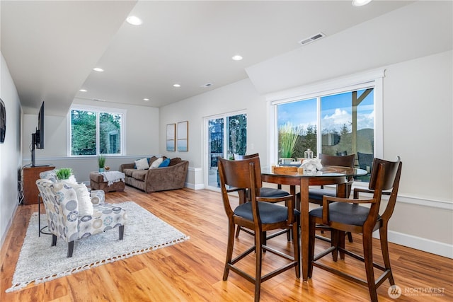 dining area featuring recessed lighting, visible vents, light wood finished floors, and baseboards