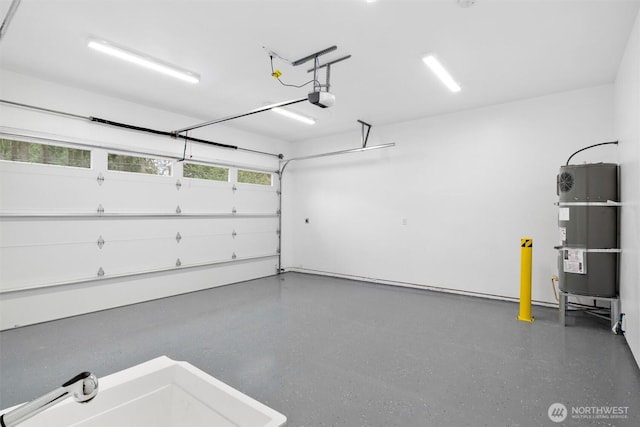 garage with strapped water heater and a garage door opener