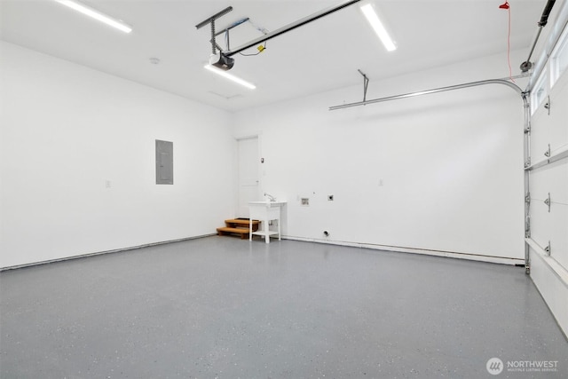 garage featuring electric panel, a garage door opener, and a sink