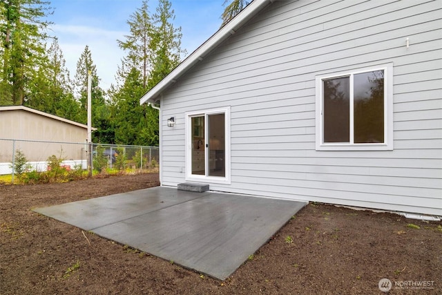 back of house featuring a patio and fence