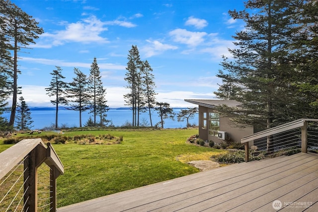 deck with a lawn and a water view