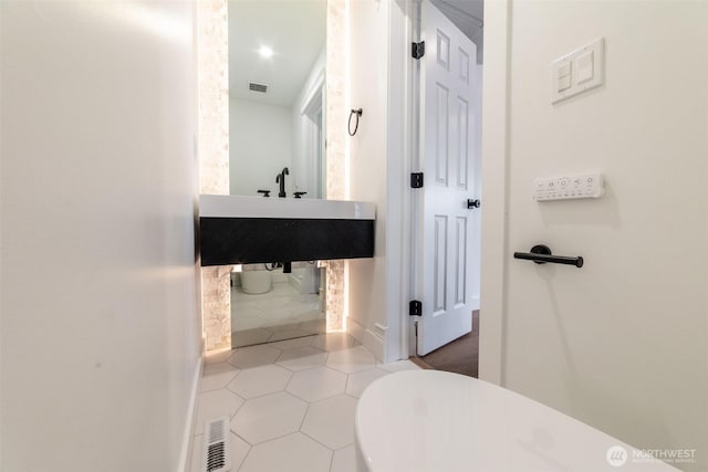 bathroom with tile patterned floors and visible vents