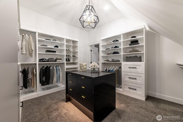 walk in closet featuring vaulted ceiling and dark colored carpet