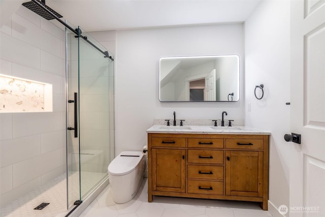 bathroom featuring double vanity, a stall shower, toilet, and a sink