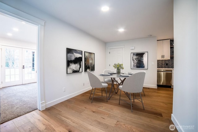 dining area with light wood finished floors, recessed lighting, and baseboards