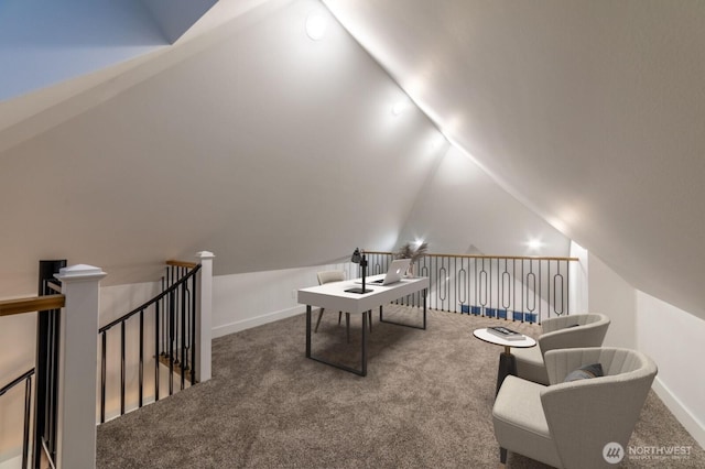 office featuring lofted ceiling, baseboards, and carpet floors