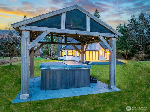 view of patio / terrace featuring a gazebo and a hot tub