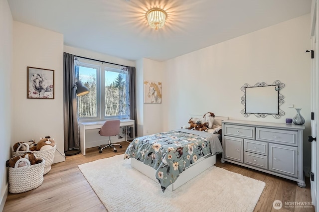 bedroom featuring wood finished floors