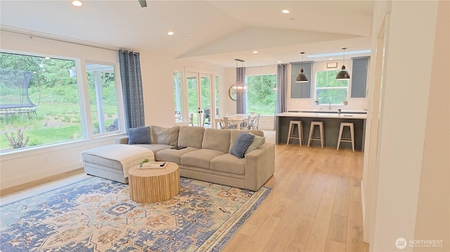 6137 404th Ln SE, Snoqualmie, WA 98065 - living room featuring light wood-style floors, lofted ceiling, and recessed lighting