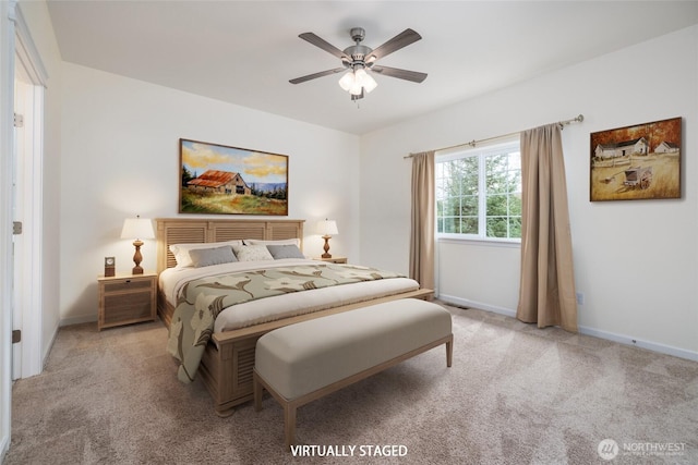bedroom with light carpet, baseboards, and ceiling fan