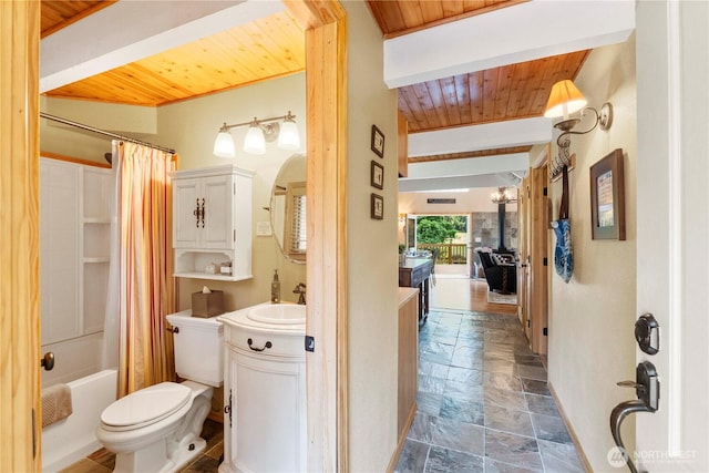 full bathroom with vanity, shower / bathtub combination with curtain, stone tile flooring, wooden ceiling, and toilet