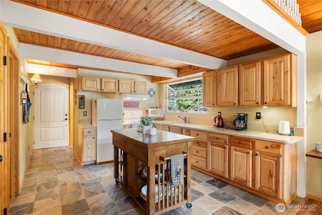 kitchen with beam ceiling, stone finish flooring, white appliances, light countertops, and wood ceiling