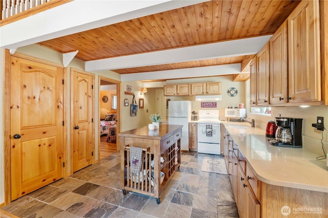 kitchen featuring stone finish flooring, white appliances, beam ceiling, and wooden ceiling