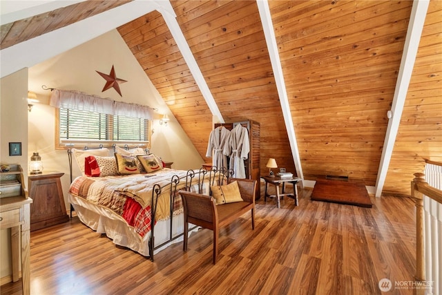 bedroom featuring wooden ceiling, vaulted ceiling with beams, and wood finished floors