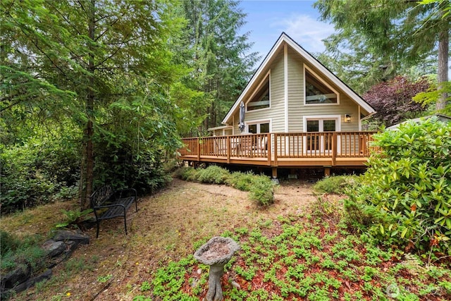 rear view of house with a wooden deck