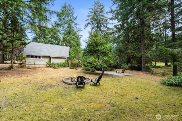 view of yard with a patio and a fire pit