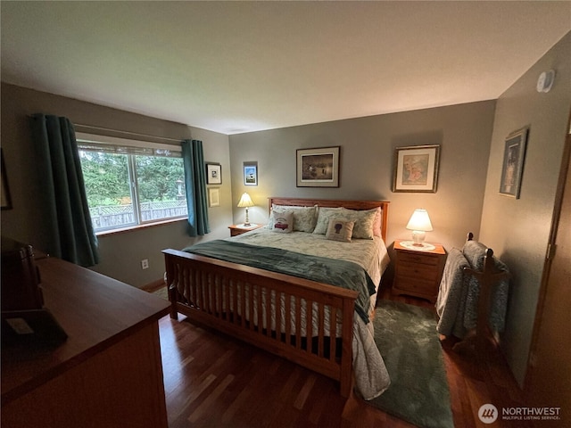 bedroom with wood finished floors