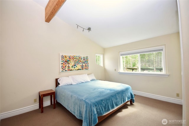 carpeted bedroom with lofted ceiling with beams and baseboards