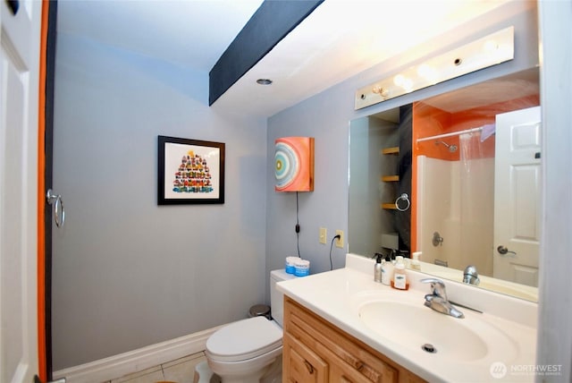 bathroom with baseboards, toilet, vanity, and a shower with curtain