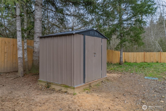 view of shed featuring a fenced backyard