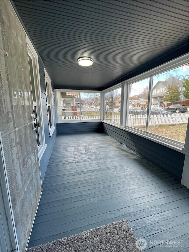 unfurnished sunroom with a healthy amount of sunlight