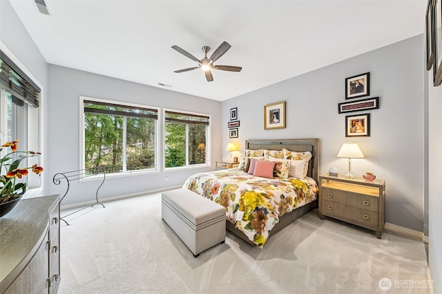 bedroom featuring baseboards, visible vents, multiple windows, and carpet flooring
