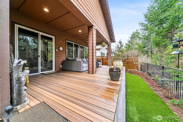 wooden deck featuring a fenced backyard