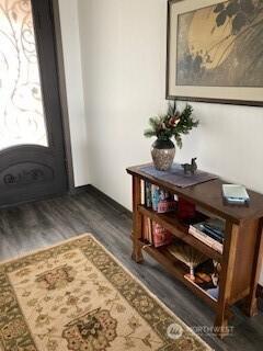 foyer featuring wood finished floors