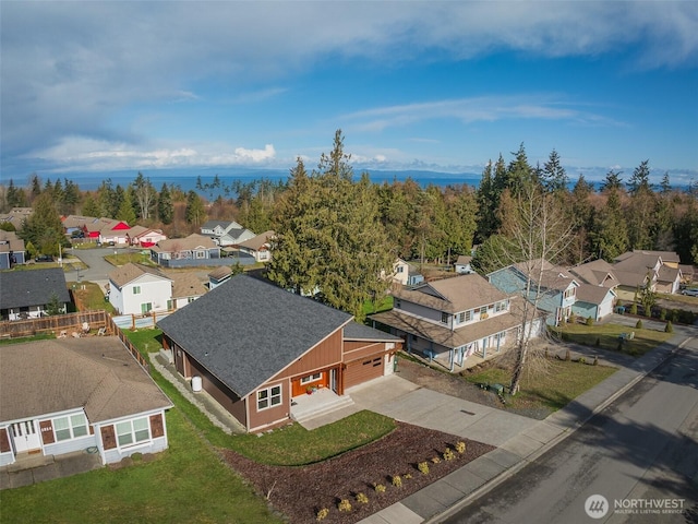 bird's eye view with a residential view and a water view