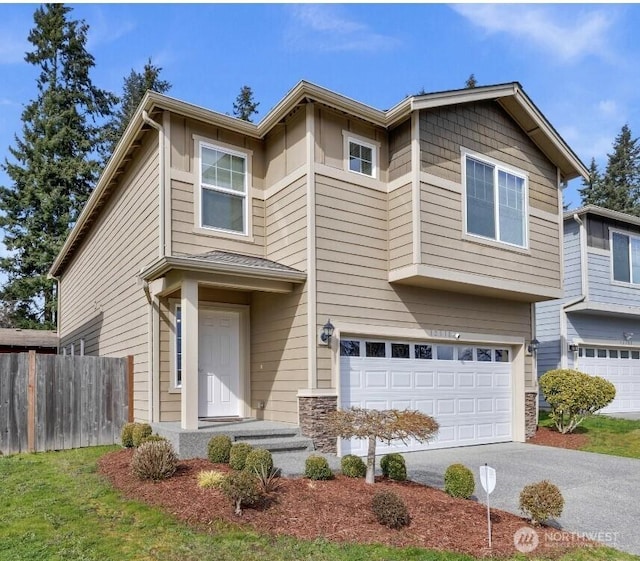 view of front of property featuring an attached garage, fence, stone siding, and driveway