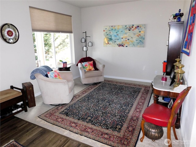 living room featuring wood finished floors and baseboards