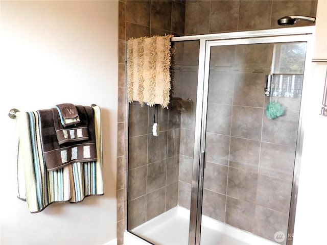 full bath with a shower stall