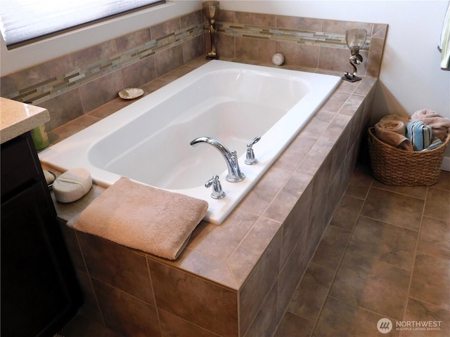 full bath with a bath, tile patterned floors, and vanity