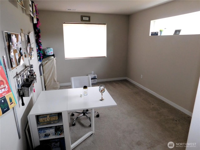 office featuring visible vents, carpet, and baseboards