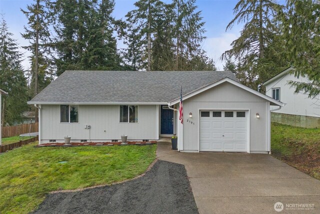 ranch-style house with concrete driveway, fence, a garage, and a front lawn