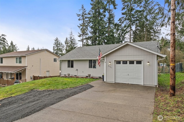 ranch-style home featuring fence, roof with shingles, concrete driveway, a front yard, and a garage
