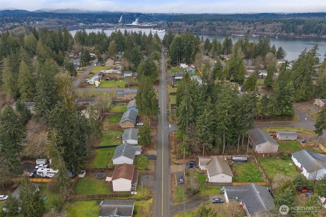 bird's eye view with a view of trees and a water view