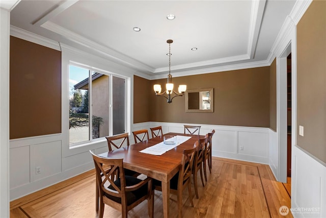 19665 SE 310th Pl, Kent, WA 98042 - dining room featuring light wood-type flooring, crown molding, a wainscoted wall, a chandelier, and a decorative wall