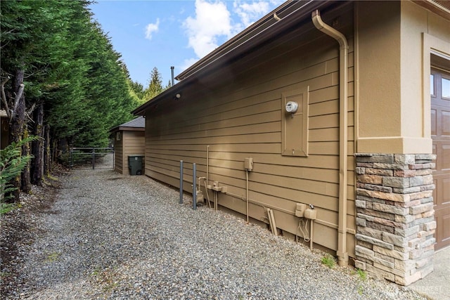 19665 SE 310th Pl, Kent, WA 98042 - view of side of property featuring a gate and stone siding