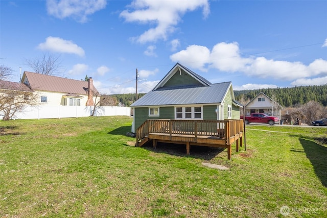 308 S 1st St, Roslyn, WA 98941 - rear view of house with a wooden deck, a yard, metal roof, and fence